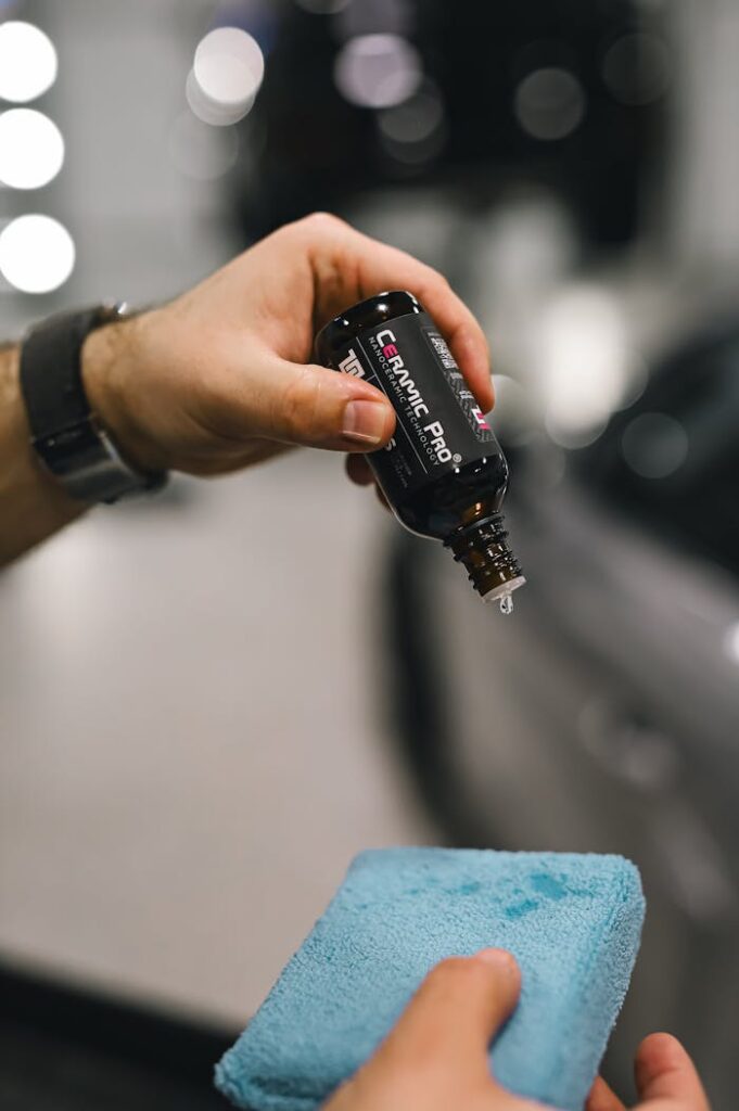 applying-car-cleaner-on-blue-sponge-20051453 Applying Car Cleaner on Blue Sponge