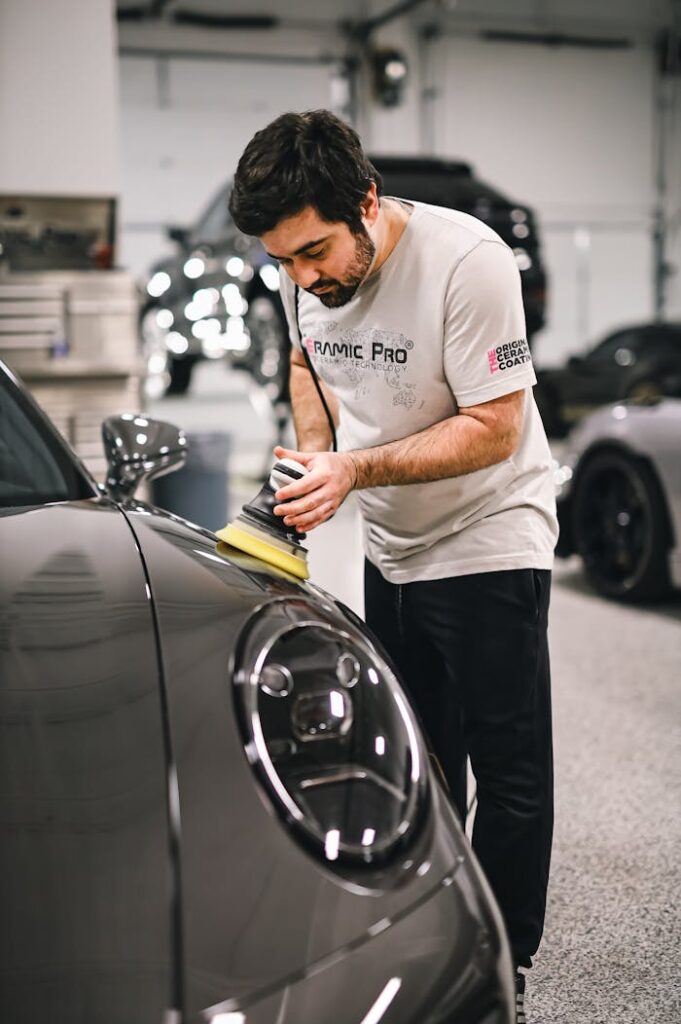 man-cleaning-sports-car-20042056 Man Cleaning Sports Car